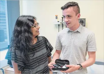  ?? RYAN REMIORZ THE CANADIAN PRESS ?? Dr. Kaberi Dasgupta, left, chats with study participan­t and co-author Michael Wright about blood-sugar testing at the MUHC superhospi­tal in Montreal.