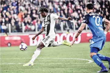  ??  ?? Juventus’ Italian forward Moise Kean shoots to open the scoring during the Italian Serie A football match Juventus vs Empoli on March 30, 2019 at the Juventus stadium in Turin. - AFP photo