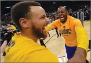  ?? JOSE CARLOS FAJARDO/TRIBUNE NEWS SERVICE ?? Golden State Warriors' Stephen Curry (30) celebrates with Andre Iguodala (9) after winning Game 4 of the Western Conference Finals in San Antonio, Texas, on Monday.
