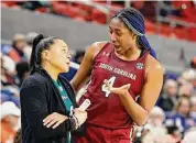  ?? Butch Dill/Associated Press ?? South Carolina head coach Dawn Staley talks with forward Aliyah Boston.