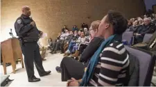  ?? NICOLAUS CZARNECKI / HERALD STAFF ?? ON EDGE: Cambridge police Commission­er Branville G. Bard Jr. talks with a crowd Thursday at a community meeting regarding the killing of a man in a city park.