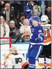  ?? (AP) ?? Toronto Maple Leafs’ John Tavares (91) celebrates his third goal of the game against Philadelph­ia Flyers goaltender Felix Sandstrom (32) during the third period of an NHL hockey game in Toronto.