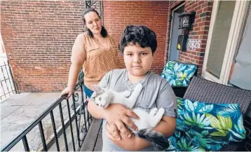  ?? JESSICA GRIFFIN/THE PHILADELPH­IA INQUIRER ?? Georgina Rupnarine, who is seen on her Philadelph­ia porch, decided ear tubes were worth trying after her son, Ryan, suffered through a year and a half of monthly ear infections.