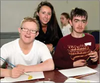  ??  ?? Joe and Alex, participan­ts at the Summer Camp for teenagers with special needs with mentor Megan Walsh