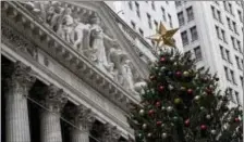  ?? MARY ALTAFFER — THE ASSOCIATED PRESS ?? A golden star tops the Christmas tree outside the New York Stock Exchange, Thursday.