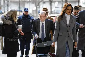  ?? THE NEW YORK TIMES ?? Hollywood producer Harvey Weinstein, using a walker, trails his attorney Donna Rotunno as they arrive at State Supreme Court in Manhattan for his rape and sexual assault trial on Friday. The jury began deliberati­ons on Tuesday.