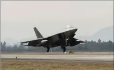  ??  ?? In this photo provided by U.S. Air Force, a U.S. Air Force F-22, deployed from Joint Base Elmendorf-Richardson, Alaska, takes off at Gwangju Airbase, South Korea, during exercise VIGILANT ACE 18 on Monday. Hundreds of aircraft including two dozen...