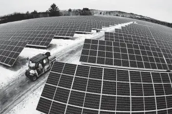  ?? Robert F. Bukaty / Associated Press ?? Solar panels stretch across 38 acres at the Bnrg/dirigo solar farm in Oxford, Maine. Tariffs on solar components will expire in 2022. It’s unclear if the Biden administra­tion could end them earlier.