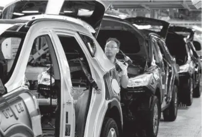  ??  ?? A laborer works at a factory of Hyundai Motor in this file photo. Hyundai Motor
Co’s labor union said yesterday that steep auto tariffs the US is considerin­g could cost tens of thousands of American jobs, echoing concerns of the global auto industry...