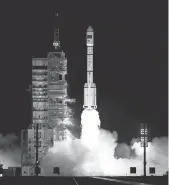  ?? AP ?? The Long March 7 rocket blasts off from the Jiuquan Satellite Launch Center. China’s growing presence in space is worrying some lawmakers.