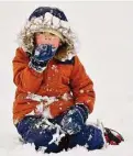  ?? Allan Jung/Associated Press ?? Maxwell Ribeiro, 4, plays in the snow Tuesday in Worcester, Mass. Storms there have delayed travel and shuttered schools.