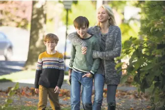  ?? Alison Cohen Rosa / Focus Features ?? Peter (Jacob Tremblay, left) and Henry (Jaeden Lieberher), the family financial manager, are the sons of single mom and waitress Susan (Naomi Watts) in “The Book of Henry.”