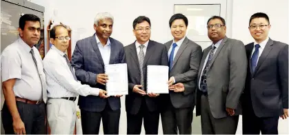  ?? ?? CPC Chairman Dammika Ranatunga and officials following the agreement signing