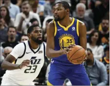  ?? AP PHOTO/ALEX GOODLETT ?? Utah Jazz forward Royce O’Neale (left) guards Golden State Warriors forward Kevin Durant (right) in the second half of an NBA basketball game Tuesday in Salt Lake City.