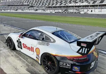  ?? PHOTO BY DALE OAKES ?? John Higgins PorscheGT3 Cup car in the pits at Daytona fo the Classic 24.