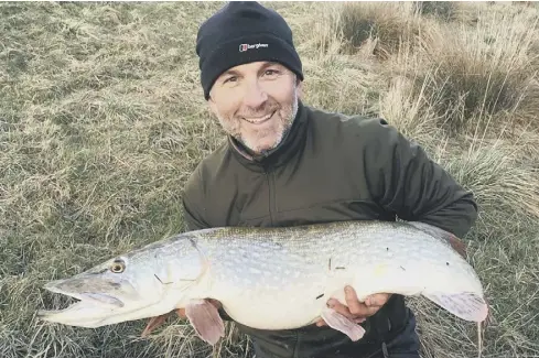  ??  ?? Colin Smithson - a pike record holder – with a 20lb pike