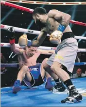  ?? Richard W. Rodriguez Associated Press ?? LUIS NERY knocked down McJoe Arroyo four times in as many rounds before his opponent quit.