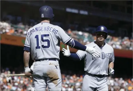  ?? PHOTO/BEN MARGOT ?? San Diego Padres’ Hunter Renfroe (right), celebrates with Cory Spangenber­g after hitting a home run off San Francisco Giants’ Johnny Cueto in the fourth inning of a baseball game Sunday in San Francisco. AP