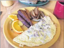  ?? KARL WELLS PHOTOS ?? Omelette Wizard’s meat lovers omelette