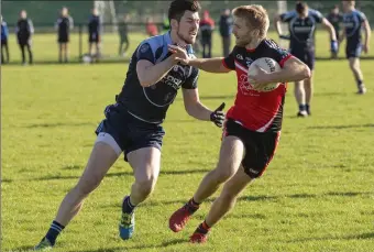  ??  ?? James Murphy and John Harvey in action. Pic: Donal Hackett.