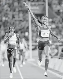  ?? David J. Phillip / Associated Press ?? United States’ Allyson Felix crosses the line to win the gold medal in the women’s 1,600-meter relay Saturday on the final night of events at Olympic Stadium in Rio de Janeiro.