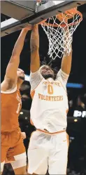  ?? USA Today Sports - Bob Donnan ?? Tennessee’s Jonas Aidoo dunks against Texas’ Dylan Disu during the Volunteers’ second-round NCAA Tournament win.