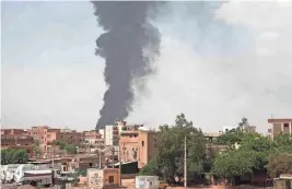  ?? AP FILE ?? Smoke rises June 8 over Khartoum, Sudan, amid fighting between the Sudanese army and paramilita­ry Rapid Support Forces.