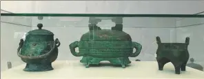  ?? CHENG YUEZHU / CHINA DAILY ?? Three of the six bronze vessels from the Shang and Zhou dynasties that the State Administra­tion of Cultural Heritage gave to the China Court Museum for its permanent collection on Tuesday.