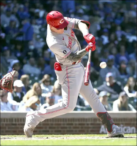  ?? Tribune News Service ?? Cincinnati Reds catcher Tyler Stephenson connects for a two-run double against the Chicago Cubs in the sixth inning
May 29 at Wrigley Field in Chicago.