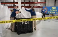 ?? ?? In this image provided by the FBI, FBI special agents assigned to the evidence response team process material recovered from the high altitude balloon recovered off the coast of South Carolina, Thursday, Feb. 9, 2023, at the FBI laboratory in Quantico, Va., (FBI via AP)
