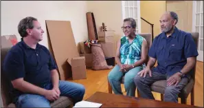  ?? (Photo courtesy of Anna Conger via The Washington Post) ?? Matt Paxton talks with two retired Washington librarians in their newly decluttere­d living room. The pair, who appear on “Legacy List,” are downsizing from their longtime home to a smaller apartment.