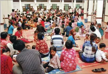  ?? KHEM SOVANNARA/AFP ?? Cambodian children and their parents sitting at Kantha Bopha children’s hospital in Phnom Penh in July 2012.