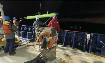  ?? Photograph: AP ?? Researcher­s on the research vessel Sally Ride deploy an autonomous underwater vehicle near Santa Catalina Island.