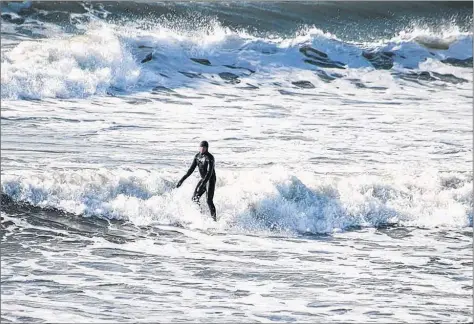  ??  ?? Angela LeBlanc captured some nice shots of Jody Lays surfing at Mavillette Beach on Jan. 21.