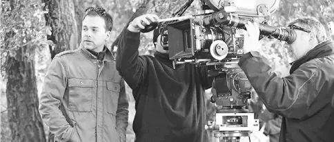  ??  ?? ‘Wonder Woman’ cinematogr­apher Jensen, left, working on set. His passion for filmmaking has roots in Washington. — Courtesy of Matt