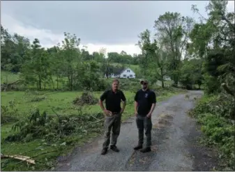  ?? SUBMitteD Photo ?? after a tornado touched down in Morgantown on May 28, State rep. Mark gillen, left, walked the storm destructio­n with national Weather Service officials as they determined the strength and path of the storm.