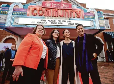  ?? Brian A. Pounds/Hearst Connecticu­t Media ?? From left; Fairfield state representa­tives Sarah Keitt, Cristin McCarthy-Vahey, and Jennifer Leeper, pose for a photo with actor Jay Hernandez on the red carpet for the world premiere of his new movie, The Long Game, at Sacred Heart University’s Community Theater in Fairfield, on Wednesday.