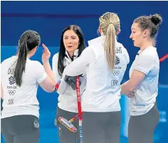  ?? ?? Eve Muirhead, second left, speaks to team-mates during the Canada game which Britain lost 7-3.
