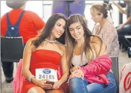  ??  ?? CONTESTANT­S bond during tryouts for the latest season of “American Idol,” which debuted Wednesday night and which featured a variety of archival clips.