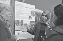  ?? IAN STEWART, SPECIAL TO THE RECORD ?? Joyce Caudle, left, and Wisam Osman of the Paulander neighbourh­ood talk about their award-winning community BBQ.