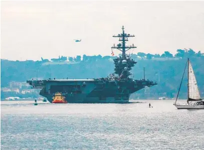  ?? JARROD VALLIERE U-T ?? The aircraft carrier Theodore Roosevelt heads out from San Diego Bay for deployment on Monday.