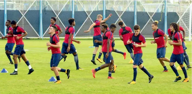  ??  ?? England players warm-up at the Salt Lake Stadium in Kolkata on Tuesday, the eve of their U-17 World Cup semi-final against Brazil.