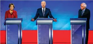  ??  ?? ON WAY OUT: Joe Biden speaks as Senator Elizabeth Warren and Senator Bernie Sanders listen during a Democratic presidenti­al primary debate. — AP file