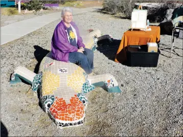  ??  ?? MYRA SALER, A YUMA ARTIST, SITS ATOP LILY LIZARD which she created for the Moody garden. Local garden clubs will have plants and garden-related items for sale at Art in the Garden and artists