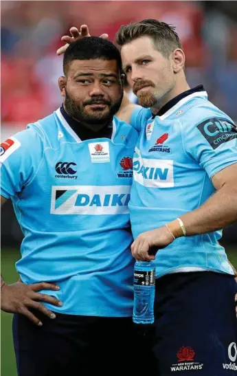  ?? Photo: Themba Hadebe ?? FEELING BLUE: Tolu Latu is consoled by Bernard Foley after the Waratahs’ Super Rugby semi-final loss to the Lions at Ellis Park.