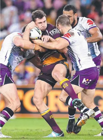  ?? Picture: GETTY IMAGES ?? Corey Oates does the hard yards against the Storm.