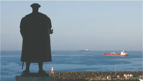  ?? MARIO PROENCA / BLOOMBERG FILES ?? A statue of explorer Vasco da Gama stands near the port of Sines, Portugal. Sines encapsulat­es what the government has identified as its future and its past as it aspires to be on the cutting edge of technology and green energy.