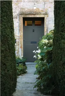  ??  ?? Above Tall and beautifull­y trimmed yew hedges flank the front path to Yews Farm, drawing the eye towards the entrance and providing the first hint of the architectu­ral elegance that awaits in the garden beyond.