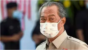  ??  ?? Positive impression: Most Malaysians are happy with Muhyiddin’s performanc­e, a recent survey found. — Bernama