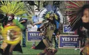  ?? Myung J. Chun Los Angeles Times ?? MEMBERS OF a dance troupe at a rally in Los Angeles in favor of a rent control initiative. One polling analyst called passing the measure “a tall order.”